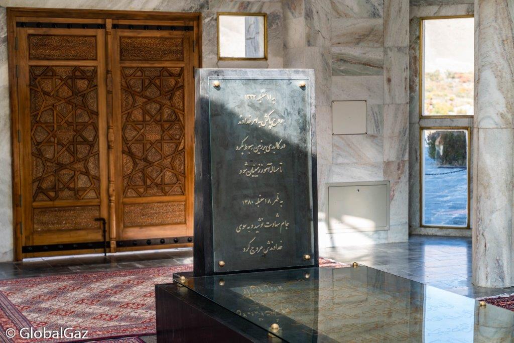 tomb of After taking off my shoes, I entered the compact room. I came face to face with a somber black tomb. The final resting place of Ahmad Shah Massoud.